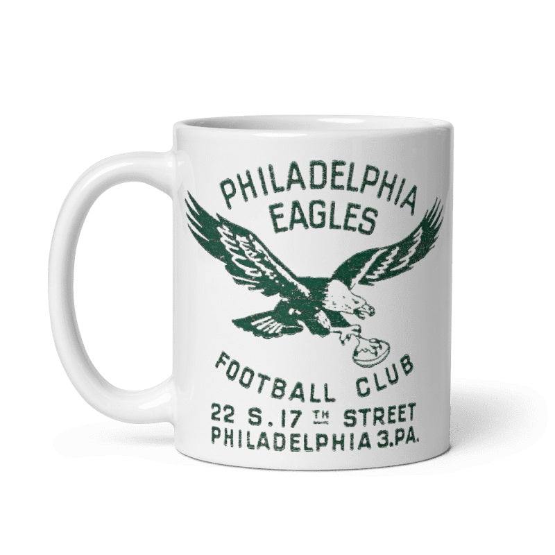 Vintage Philadelphia Eagles ceramic mug with 1940s graphic, cream color.
