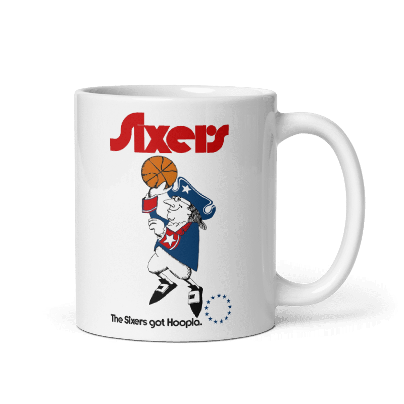 Philadelphia 76ers Got Hoopla Cream Mug featuring basketball-themed design, available in 11oz and 15oz, microwave and dishwasher safe.