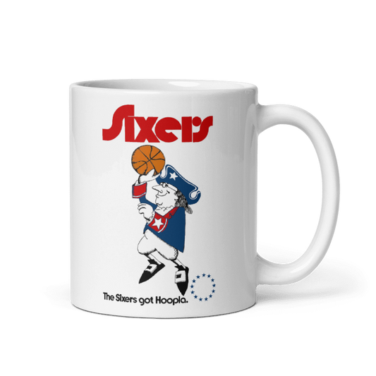Philadelphia 76ers Got Hoopla Cream Mug featuring basketball-themed design, available in 11oz and 15oz, microwave and dishwasher safe.