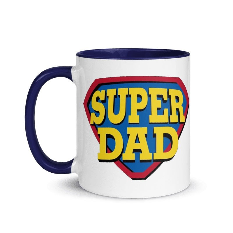 Cream-colored "Super Dad" ceramic mug with superhero emblem, 11oz, microwave and dishwasher safe, perfect Father's Day gift.