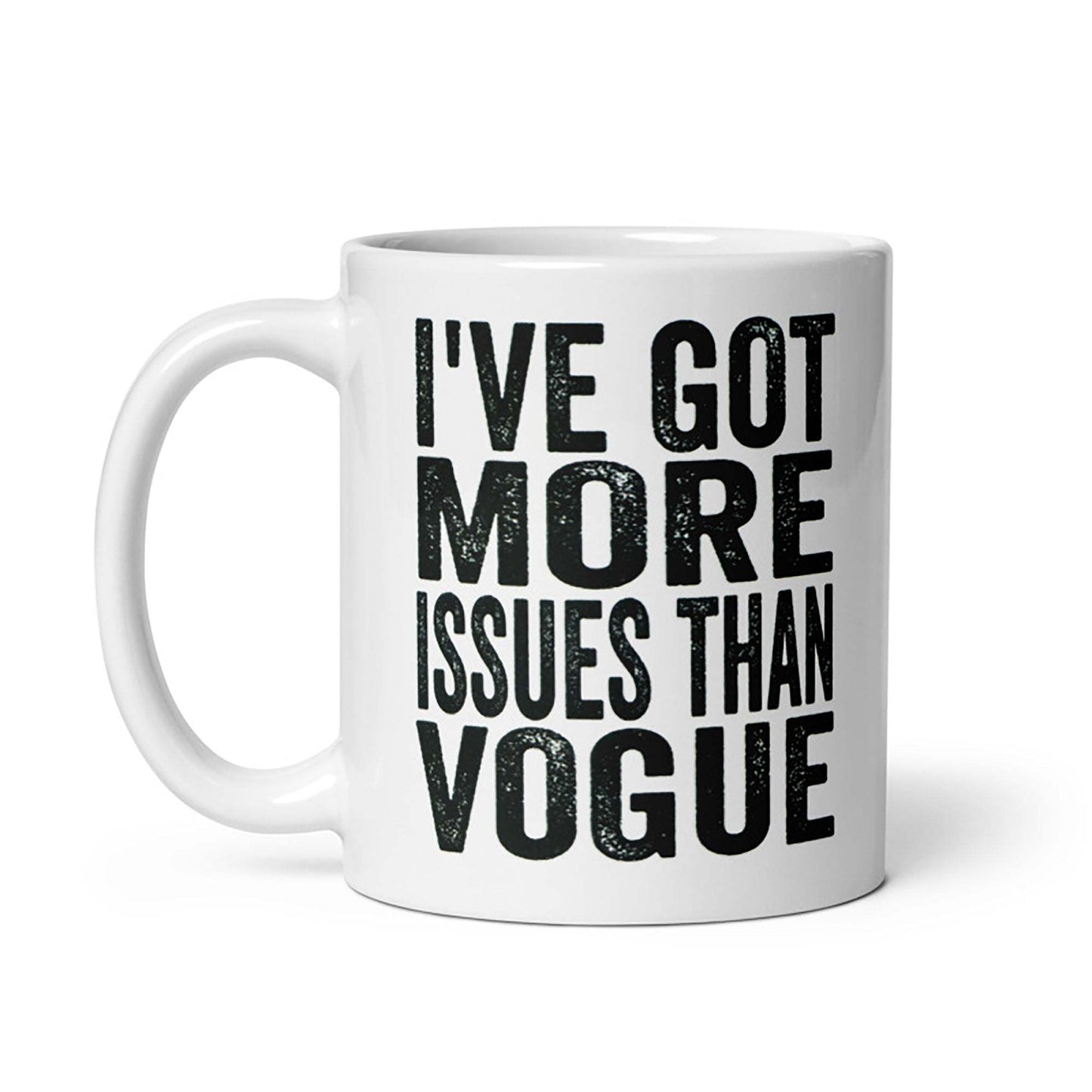 Ceramic mug with "I've Got More Issues Than Vogue" text in bold, cream color, available in 11oz and 15oz, microwave and dishwasher safe.