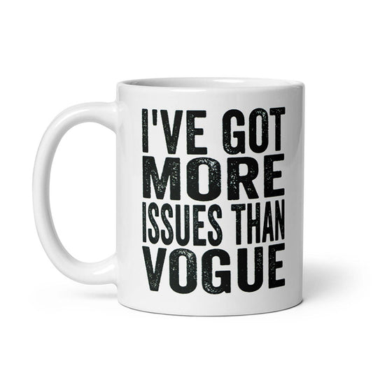 Ceramic mug with "I've Got More Issues Than Vogue" text in bold, cream color, available in 11oz and 15oz, microwave and dishwasher safe.